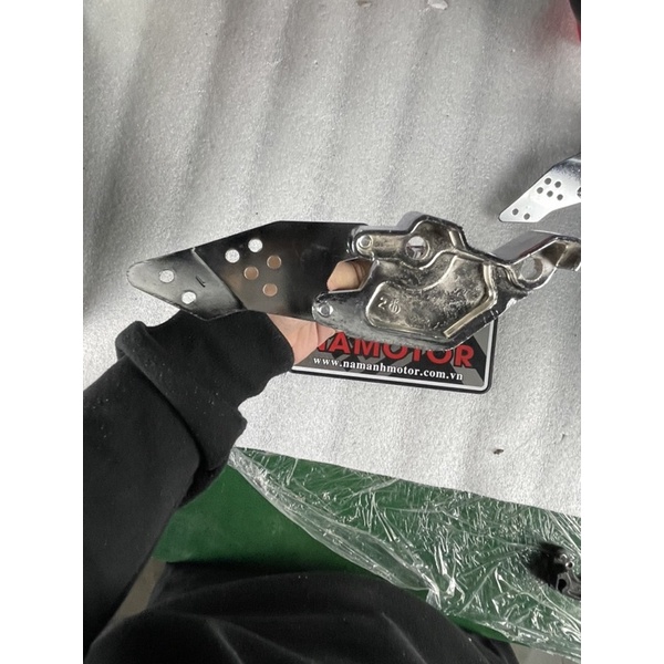 Gạt để chân xe điện Xmen