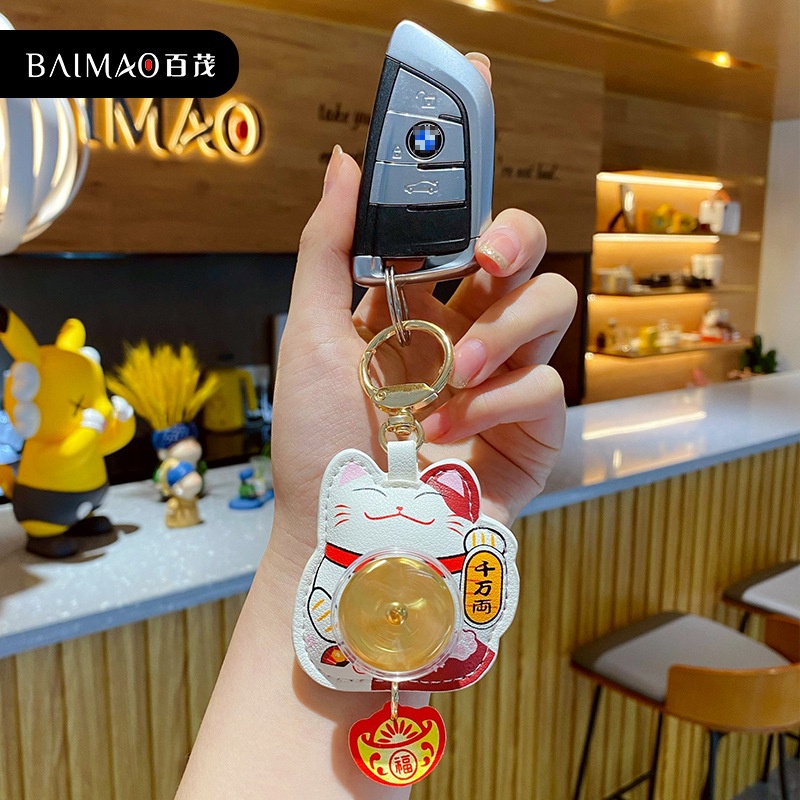 Móc khóa mèo may mắn đồng tiền xoay full hộp