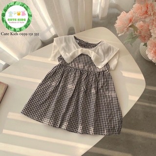 Váy sát nách cách điệu cổ nơ, caro trắng đen.