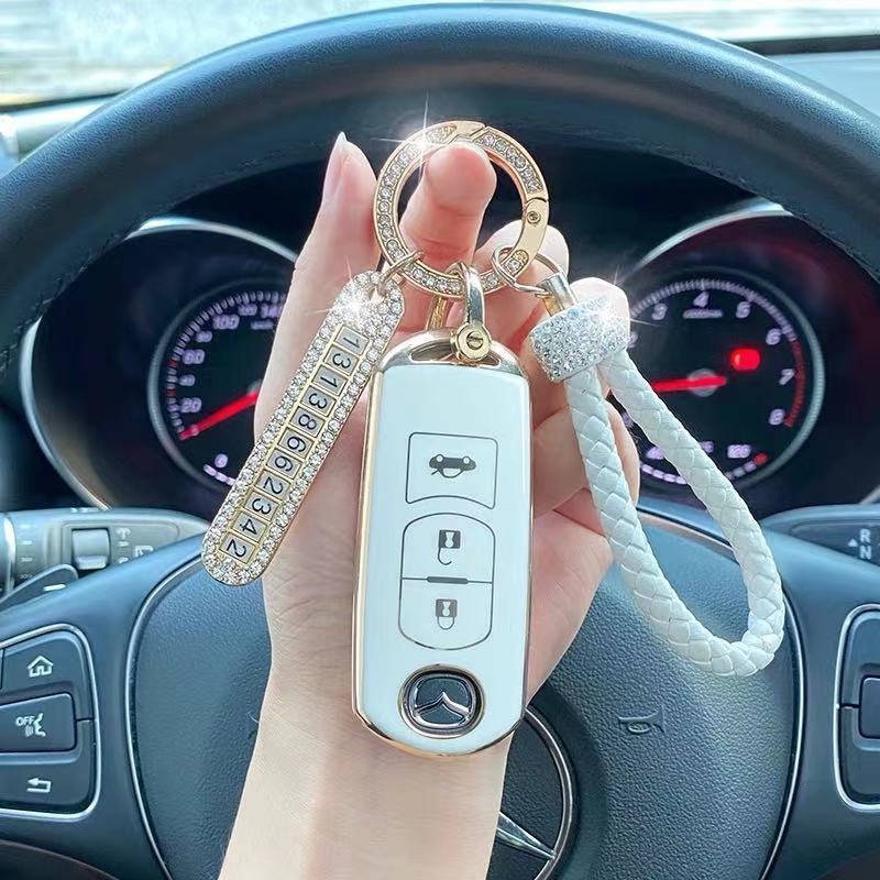 Móc Chìa Khóa Xe Hơi Có Số Điện Thoại Đính Đá Nổi Bật Màu Sắc Vàng/Bạc