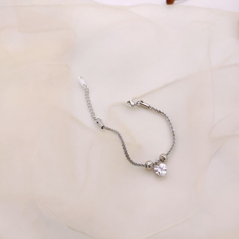 Lắc tay nữ inox xỏ bi mặt trái tim sáng đẹp không không gỉ sét