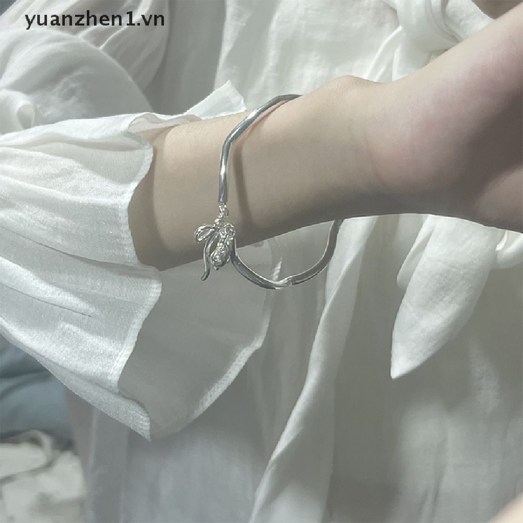 Vòng Đeo Tay Dạng Hở Màu Bạc Mặt Chuông Nơ Thời Trang Có Thể Điều Chỉnh Cho Nữ