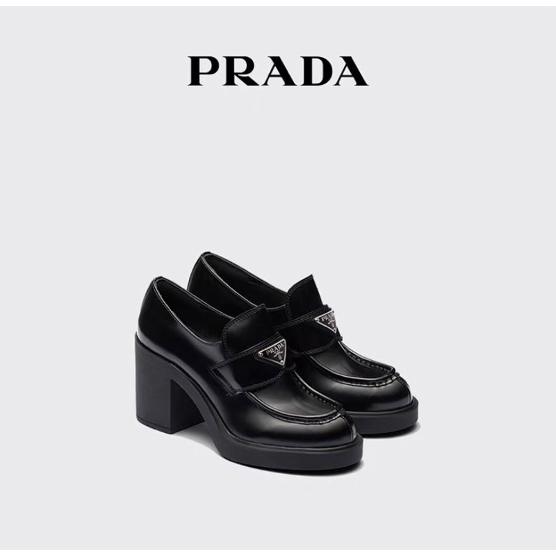 Giày Loafer Prada gót 9cm da lì