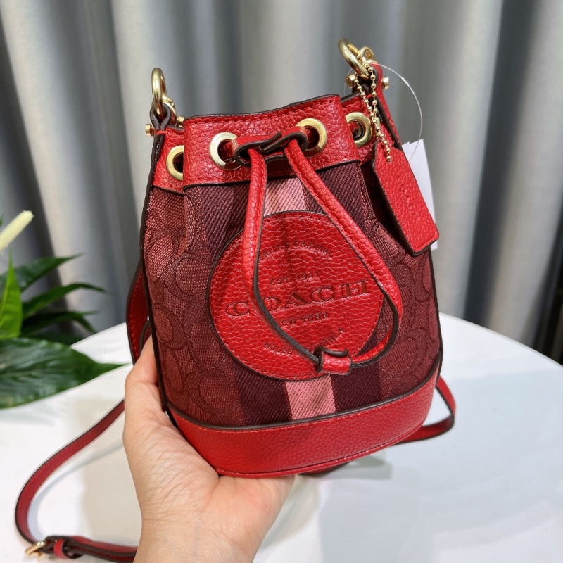 Túi xách tay C0ach bucket màu đỏ đô