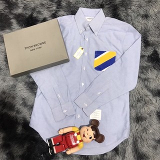Áo sơ mi thom browne xanh túi sọc vàng xanh