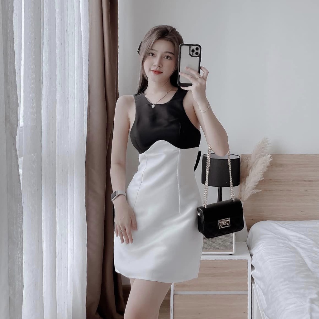 Đầm váy nữ kết nơ lưng phối 2 tone màu trắng, đen dễ phối các outfit xinh xắn dành cho các nàng diện đi chơi, dự tiệc