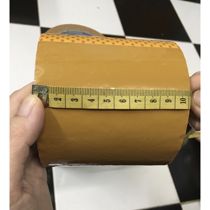 1 cuộn băng keo TRONG - ĐỤC, 100 YARD đóng hàng dán thùng