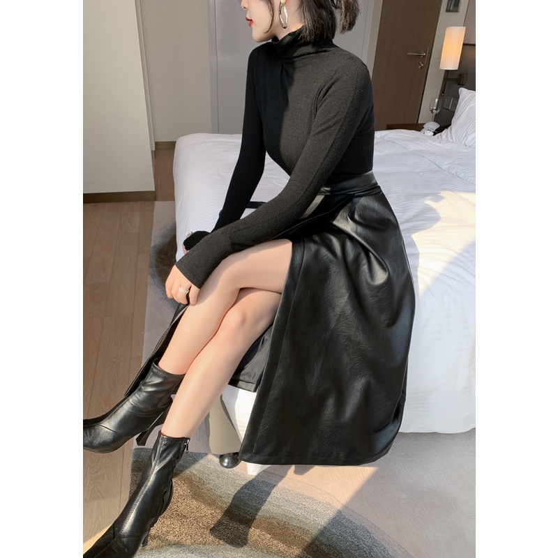 Chân váy da đắp tà có túi màu đen đơn giãn, sang trọng nhưng thời thượng.