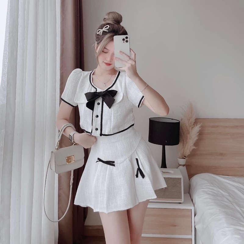 Set áo croptop viền ren nơ ngực + chân váy xoè xếp ly đính nơ