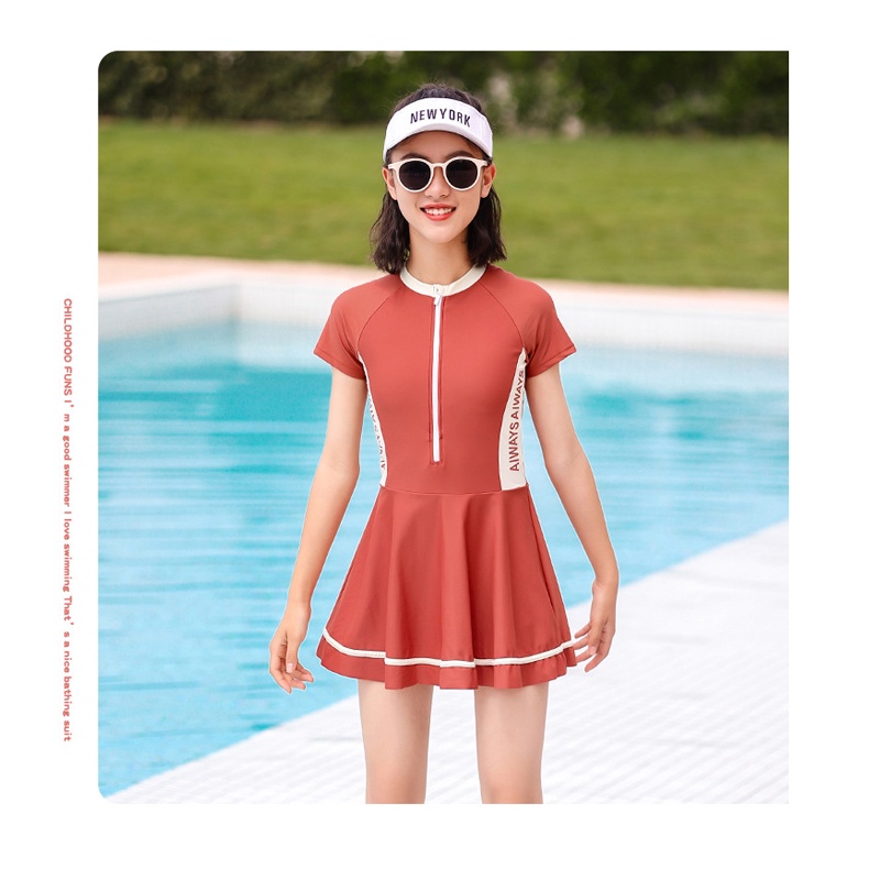 Đồ bơi bé gái YUKE mẫu liền thân chân váy tay ngắn chất vải mềm mại giúp bé vui chơi bơi lội size lớn từ 20kg đến 47kg