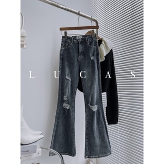 Quần jeans xanh đậm rách dáng dài ống loe