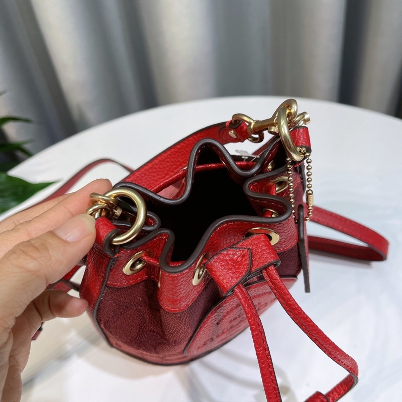 Túi xách tay C0ach bucket màu đỏ đô