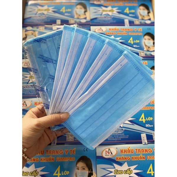 Khẩu trang y tế , 4 lớp , giấy kháng khuẩn , màu xám , trắng và xanh .
