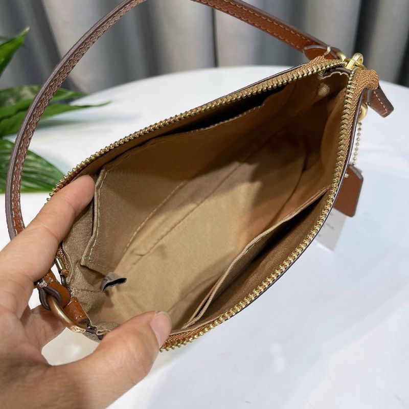 Túi Coac*h Nolita 19 kẹp nách sang trọng