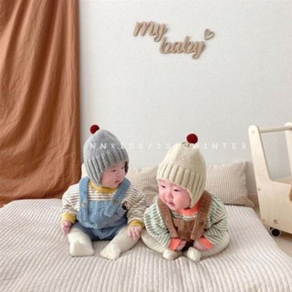 Mũ len bịt tai quả bông
