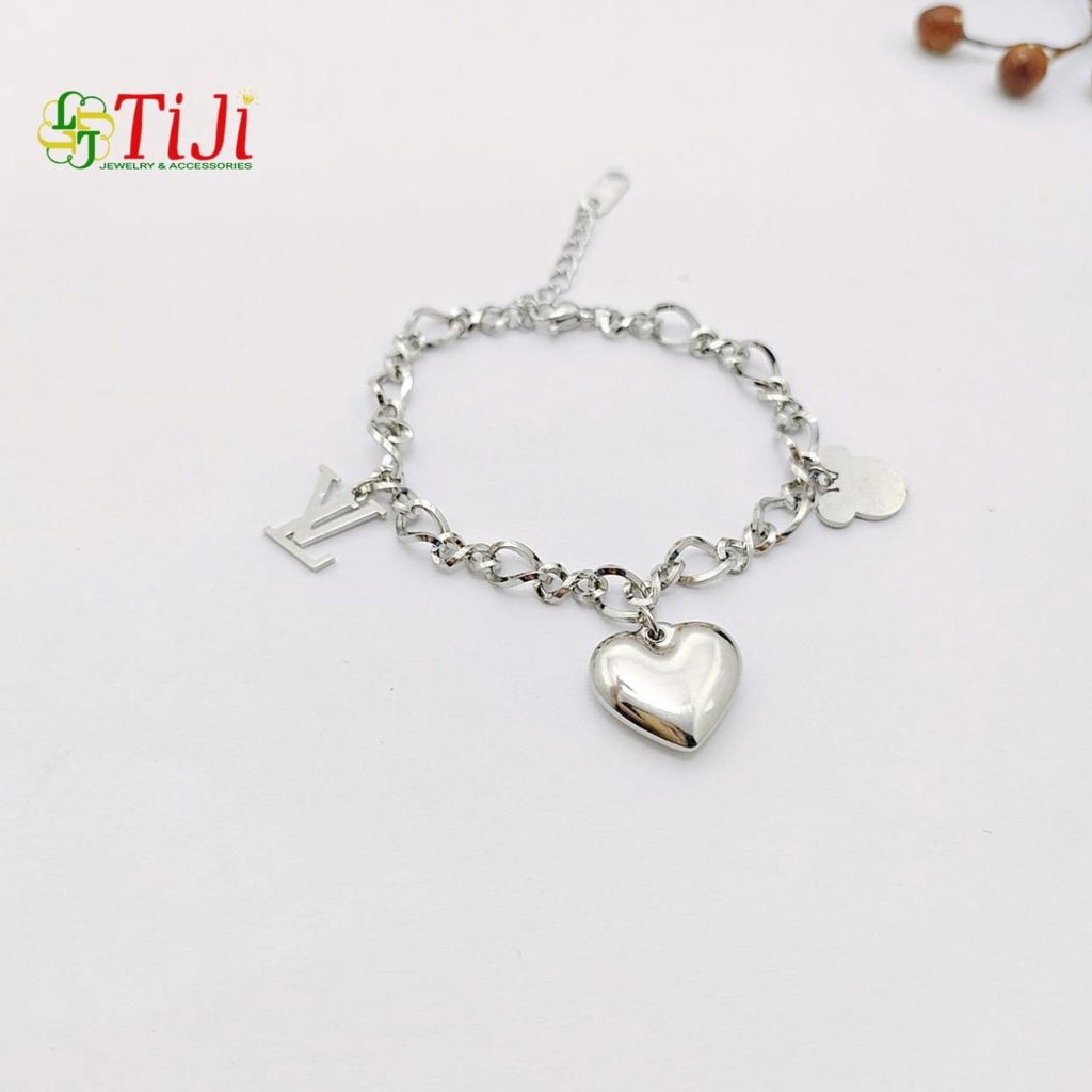 Lắc tay nữ inox kiểu xoắn mặt trái tim gắm phụ kiện không đen không gỉ sét