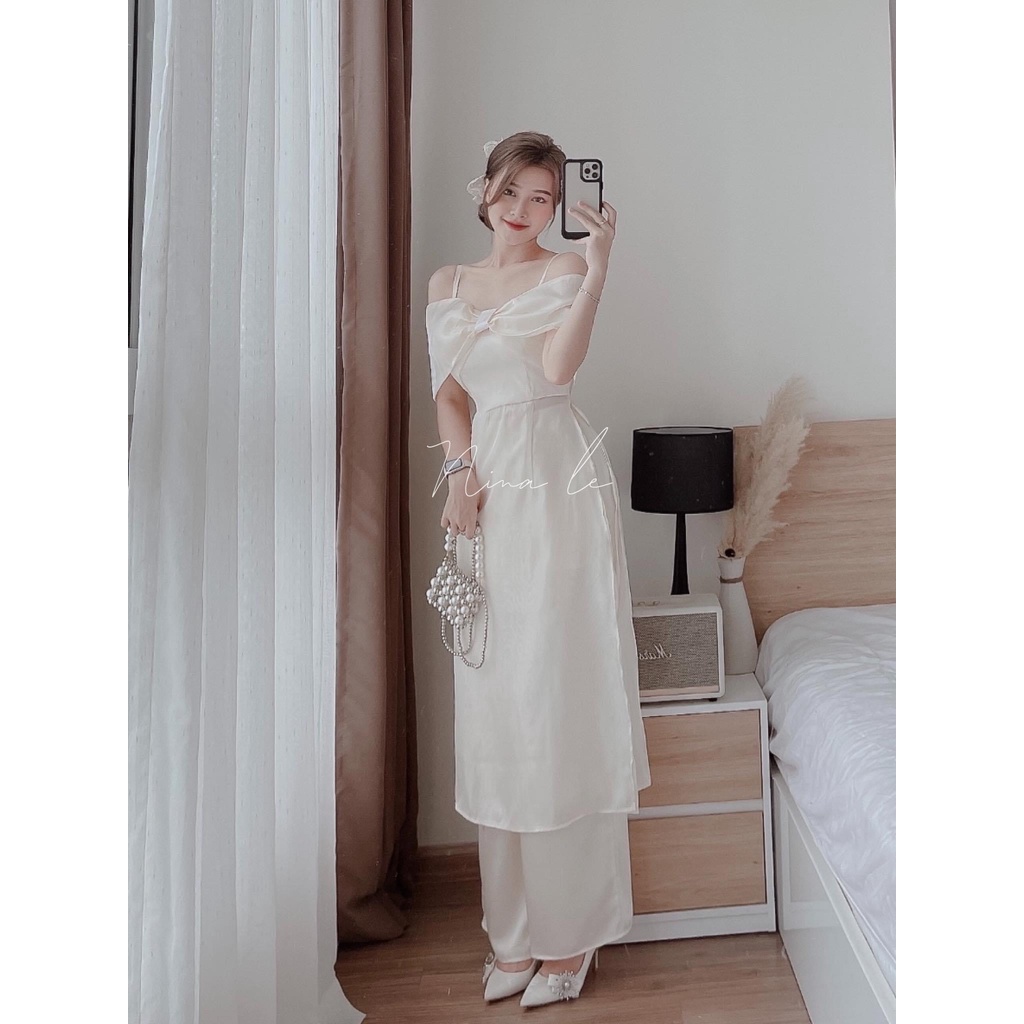 Áo dài lụa trắng hai dây trễ vai nơ ngực 4 tà