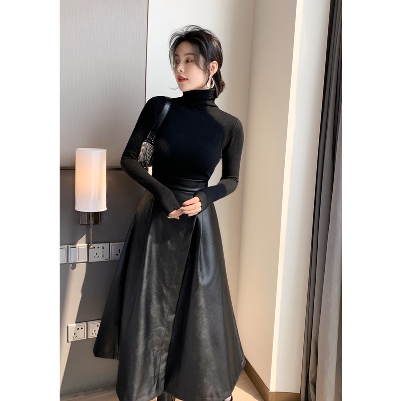 Chân váy da đắp tà có túi màu đen đơn giãn, sang trọng nhưng thời thượng.