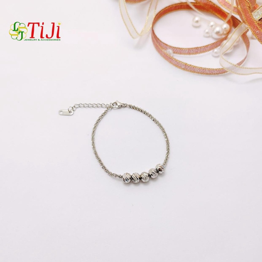 Lắc tay nữ inox kiểu xoắn xỏ bi chạm chiếu sáng đẹp không đen không gỉ sét