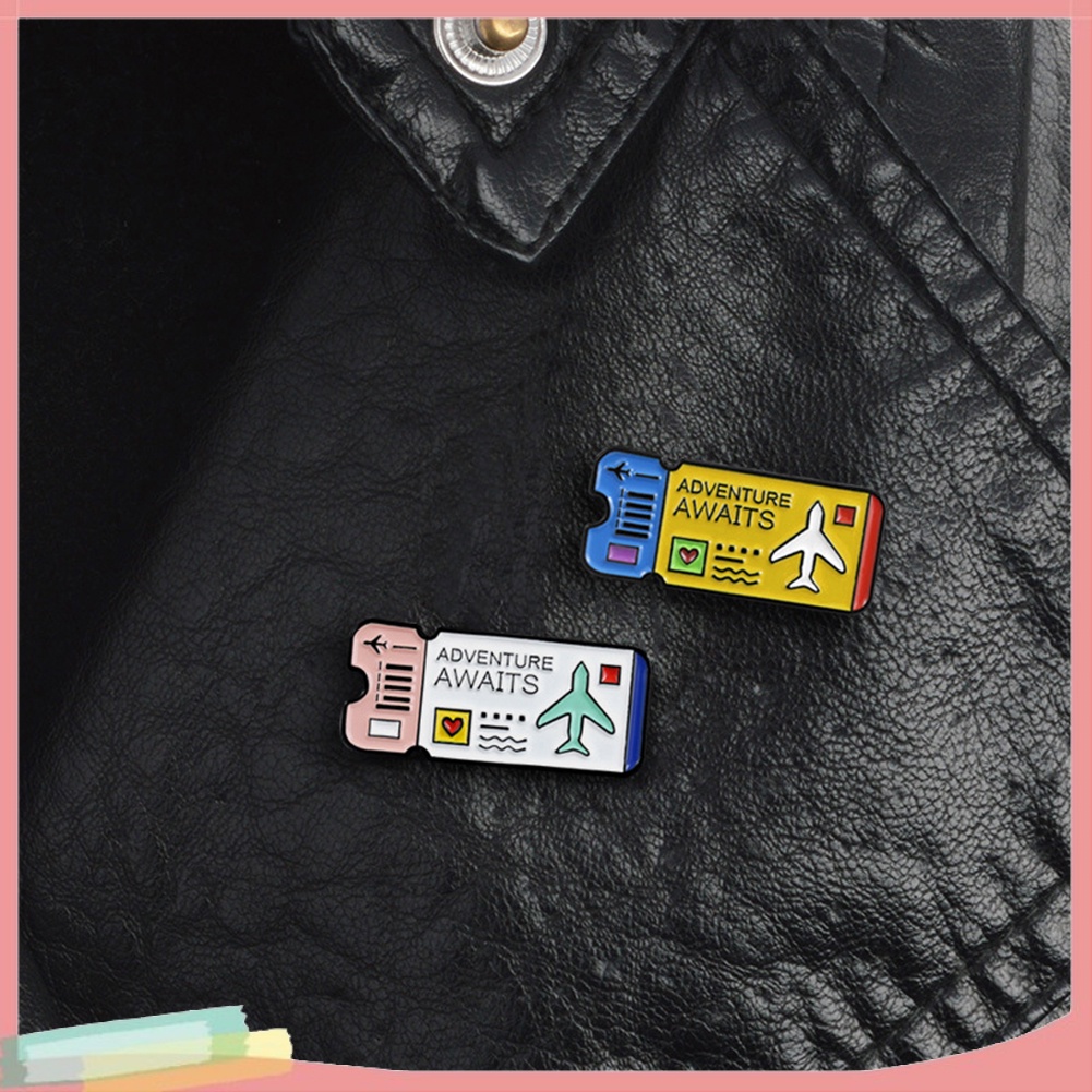 Ghim cài áo in hình vé máy bay và chữ tiếng Anh &quot; Adventure Awaits &quot;
