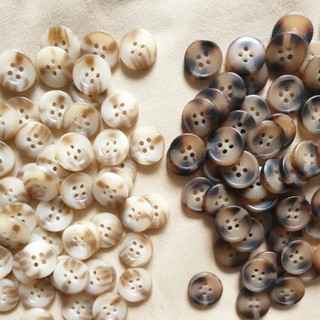 Cúc nhựa vân mây 1,5cm 50c/15k