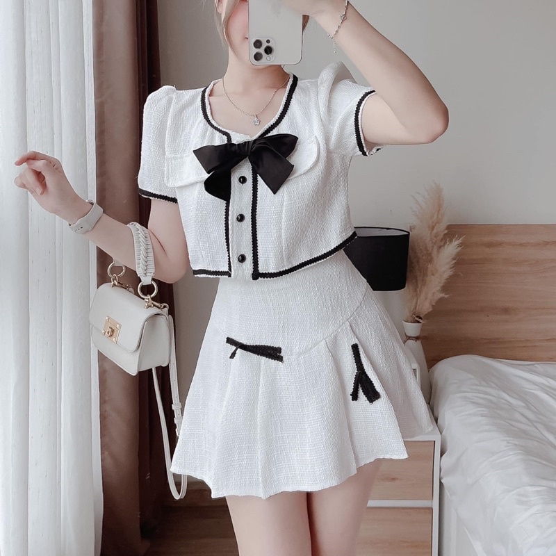 Set áo croptop viền ren nơ ngực + chân váy xoè xếp ly đính nơ