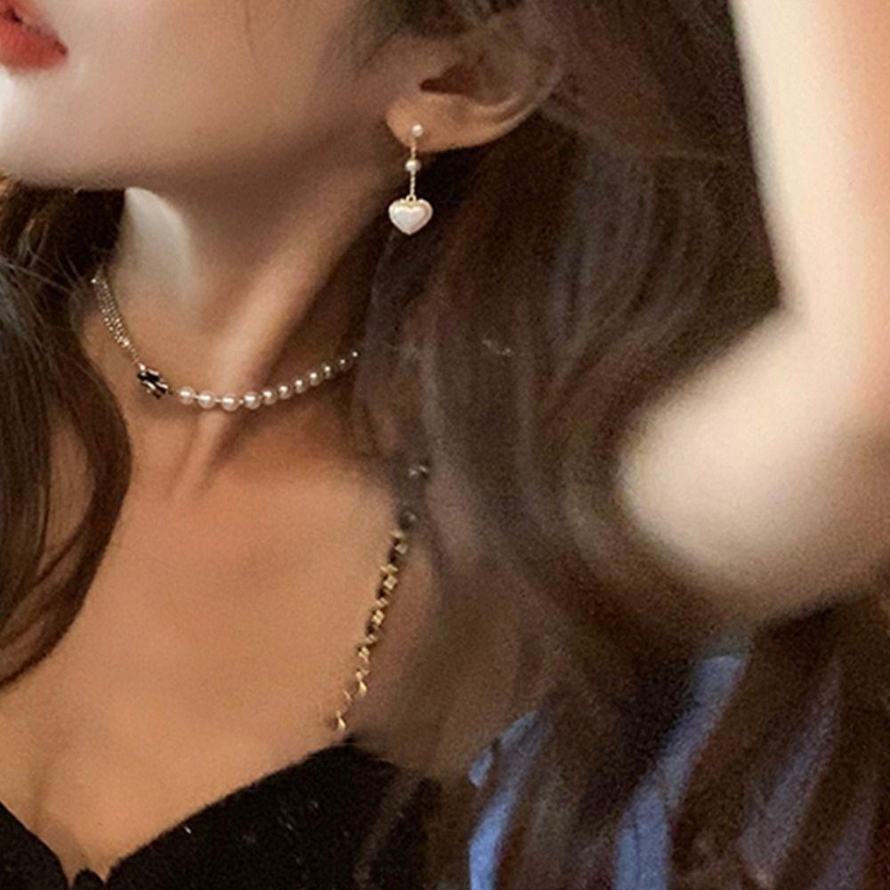 Bông Tai Hình Trái Tim Đính Nơ Sang Trọng Cho Nữ