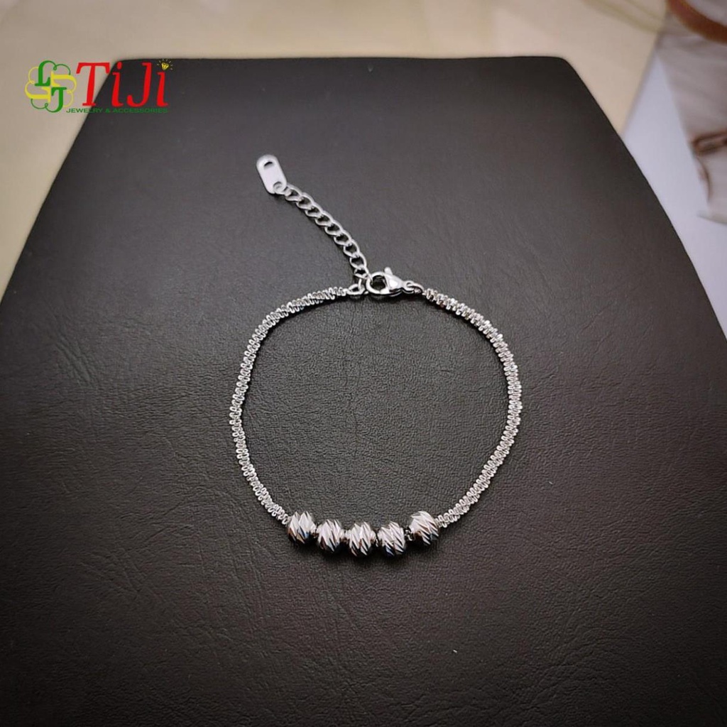 Lắc tay nữ inox kiểu xoắn xỏ bi chạm chiếu sáng đẹp không đen không gỉ sét