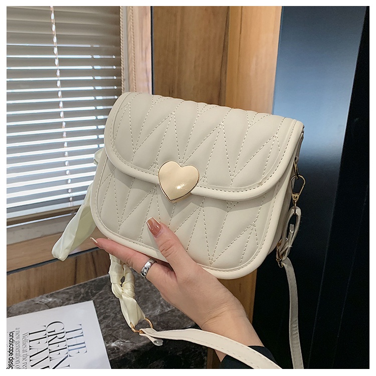 Túi xách nữ khóa trái tim dây đeo thắt nơ trẻ trung siêu xinh