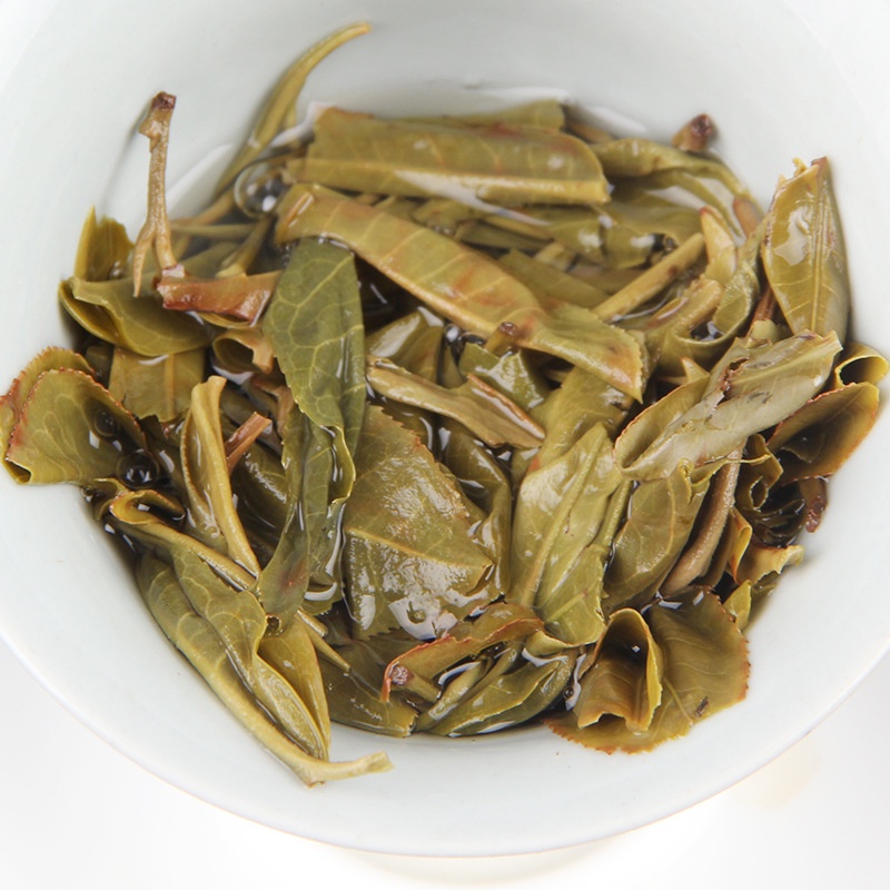 Sinh Trà Phổ Nhĩ cổ thụ- Khổng Tước Thanh Chuyên- Mãnh Hải, Vân Nam Bánh 1000 gram