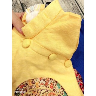 Áo dài vàng thêu thổ cẩm