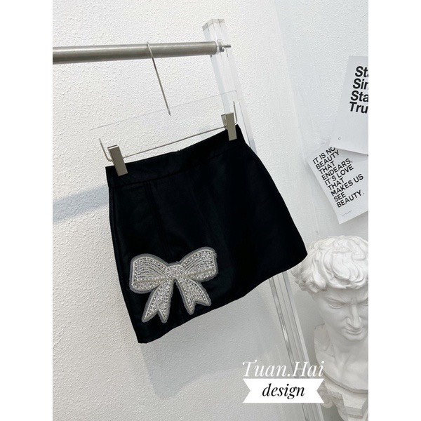 Chân váy tacta dáng chữ A đính nơ đá