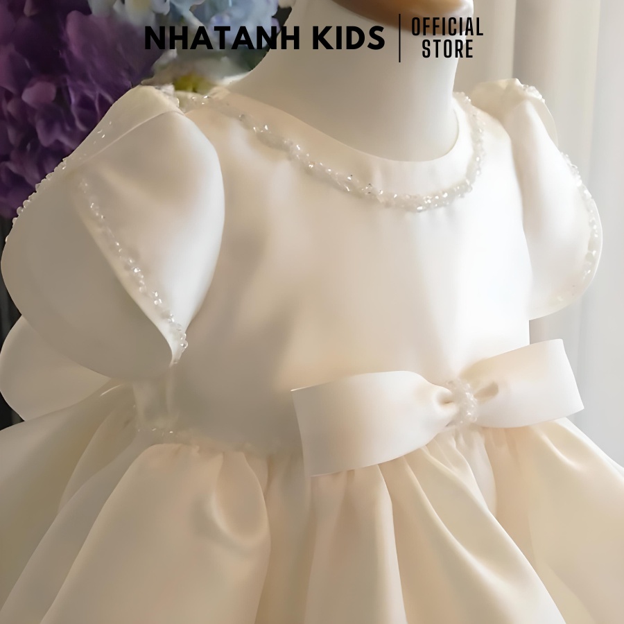 Đầm công chúa bé gái NHATANH KIDS màu trắng tay búp viền ngọc quanh váy cho bé từ 0-12 tuổi NA30