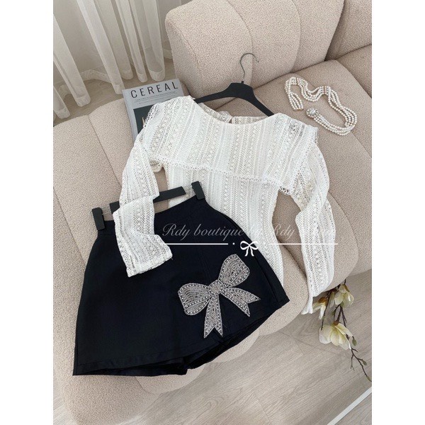 Chân váy tacta dáng chữ A đính nơ đá