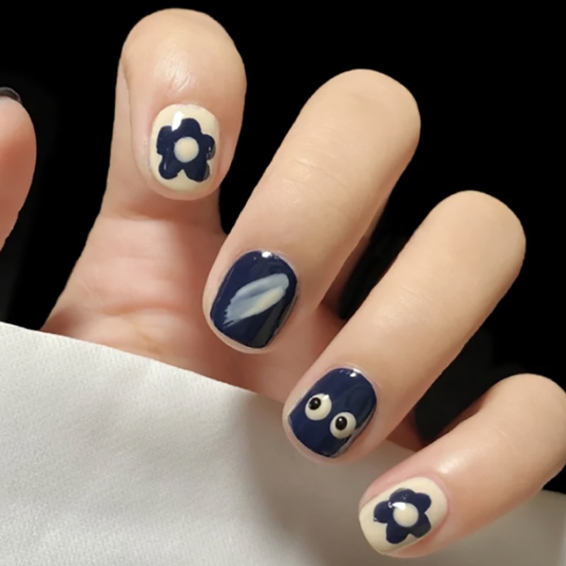 Set 24 móng tay giả YADORNOS dáng ngắn màu xanh dương hình đôi mắt hoạt hình dễ thương