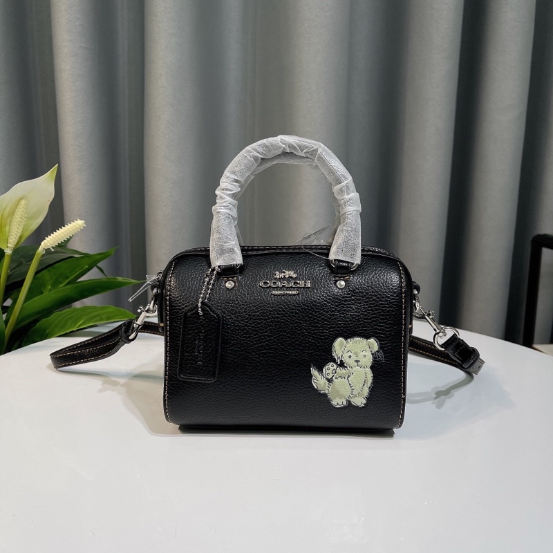 Túi đeo chéo Coach Mini Rowan Crossbody dáng trống