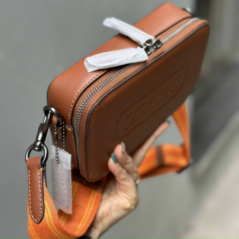 Túi COAC.H đeo chéo da thật xịn xò