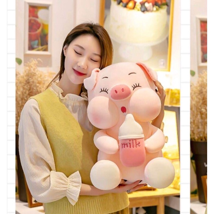 gấu bông heo ôm bình sữa ( heo mắt nhắm)