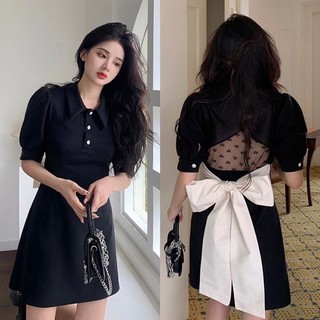 Đầm đen xoè nơ lưng trắng