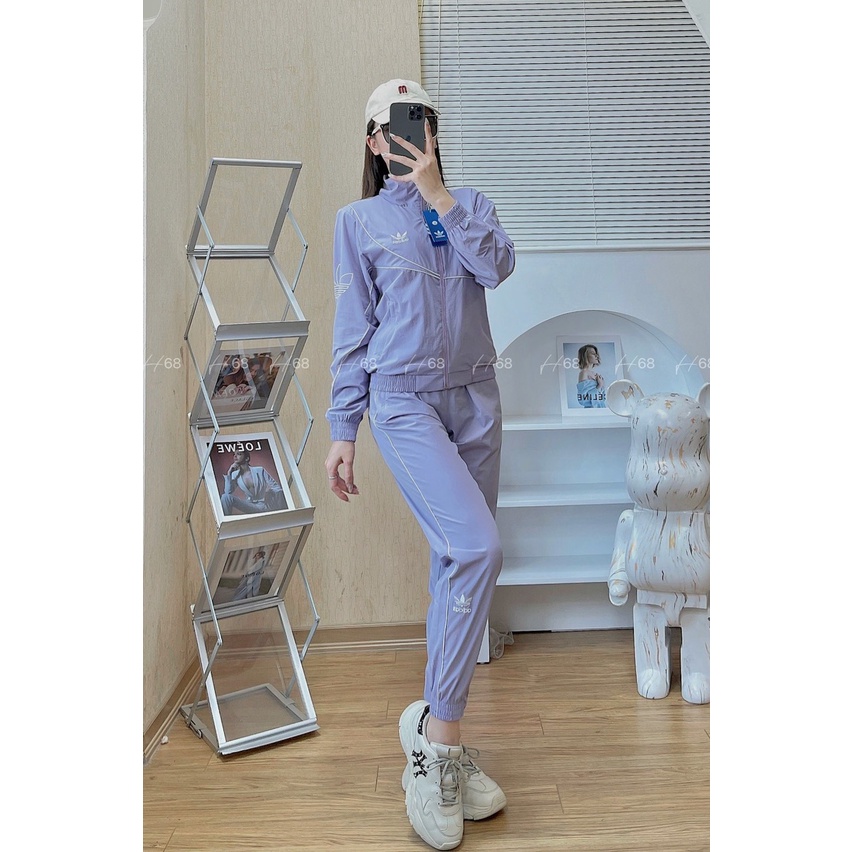 Bộ gió thể thao nữ thu đông Adidas viền trắng kéo khóa cao cấp hàng xuất dư Cambodia