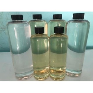 Dầu dừa nguyên chất + Chai lăn - Nấu lửa củi (500ml)