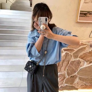 Túi đeo nữ đen hoa vàng