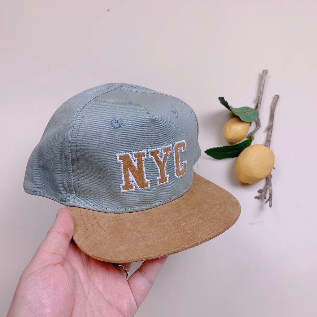 Mũ HM màu xanh phối nâu chữ NYC