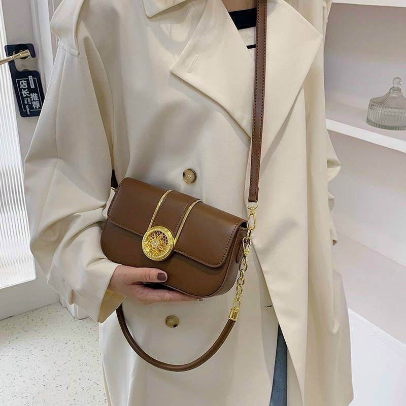 Túi đeo chéo da trơn mặt khoá vương viện dải vàng có dây tròn đeo vai