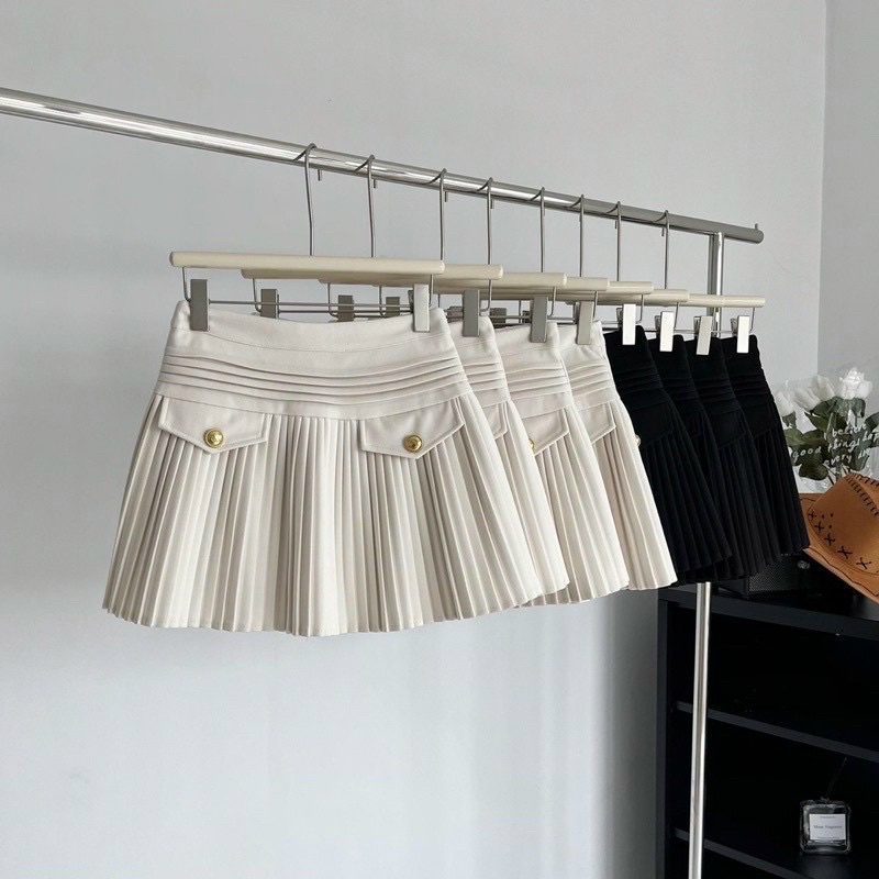 Chân váy xếp ly lưng cao xoè kèm nắp túi có khuy
