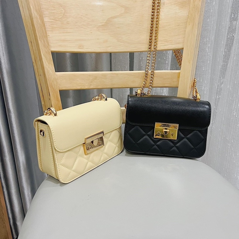 Túi C K da lì khoá nhọn trám ô