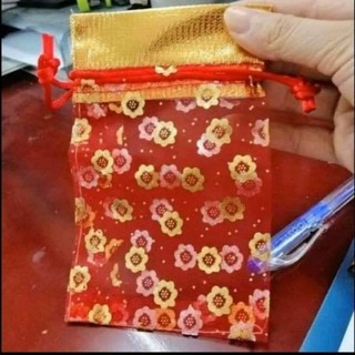 Túi voan đỏ đựng muối gạo...