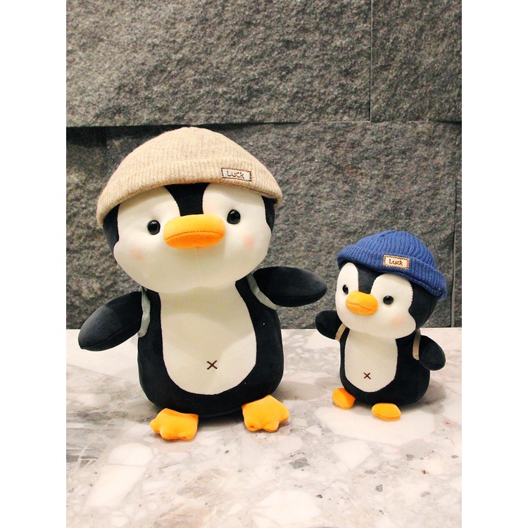 Gấu bông chim cánh cụt đội mũ đeo balo quà tặng sinh nhật gấu bông cho bé _ Unishop