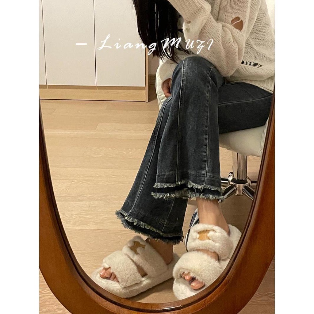 Quần jean lưng cao ống loe phối tua rua