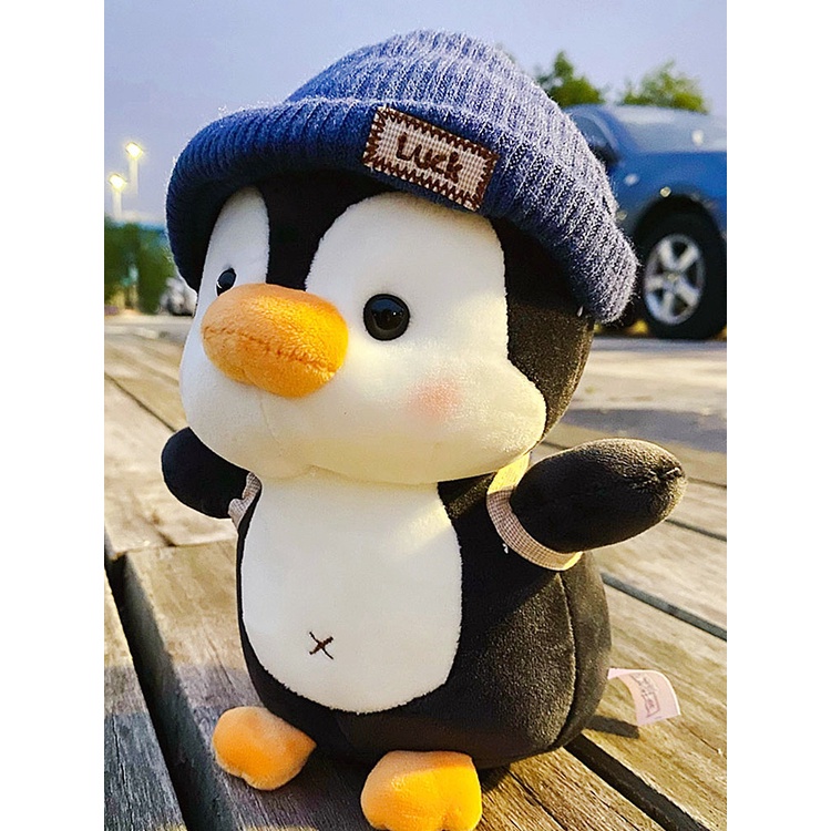 Gấu bông chim cánh cụt đội mũ đeo balo quà tặng sinh nhật gấu bông cho bé _ Unishop